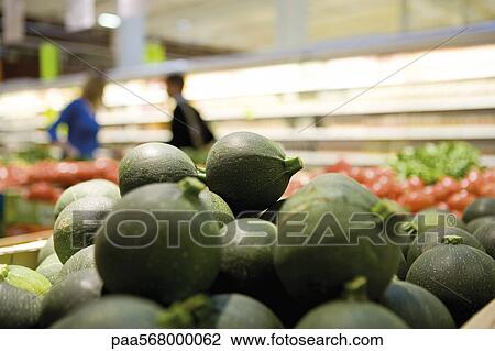 Globe zucchini display in supermarket produce section View Large Photo Image Stock Image - Globe zucchini display in supermarket produce section. Fotosearch