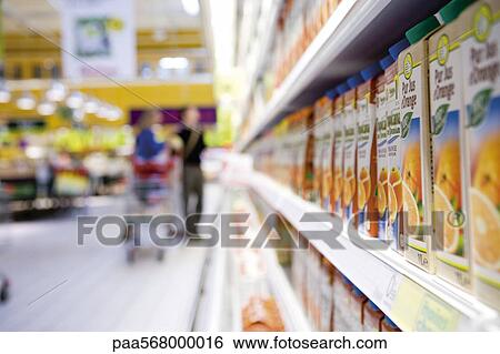 Juice cartons on shelf in supermarket cooler View Large Photo Image Stock Photograph - Juice cartons on shelf in supermarket cooler. Fotosearch