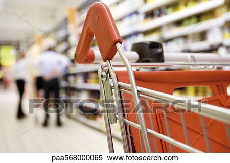 Shopping cart in supermarket, shoppers in background View Large Photo Image Stock Photography - Shopping cart in supermarket, shoppers in background. Fotosearch
