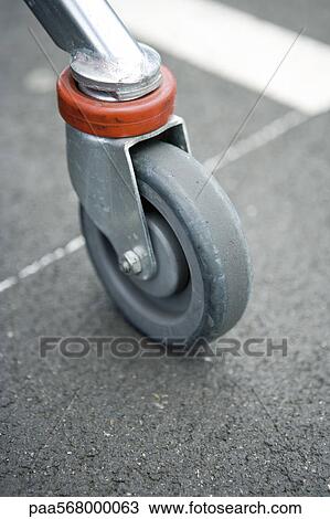 Shopping cart wheel, close-up View Large Photo Image Stock Image - Shopping cart wheel, close-up. Fotosearch