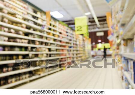 Stock Image - Supermarket aisle, defocused. Fotosearch