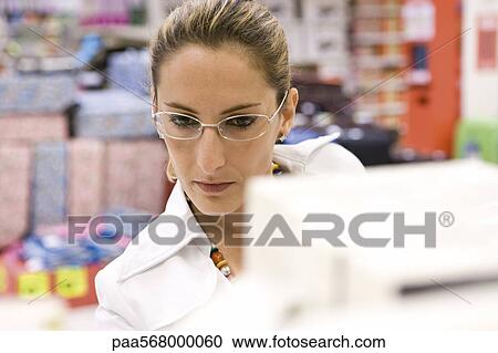 Woman in supermarket View Large Photo Image Stock Image - Woman in supermarket. Fotosearch