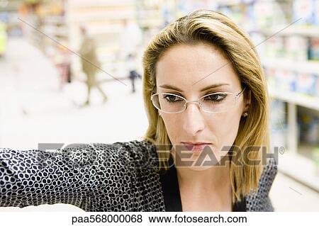 Woman in supermarket View Large Photo Image Stock Photo - Woman in supermarket. Fotosearch