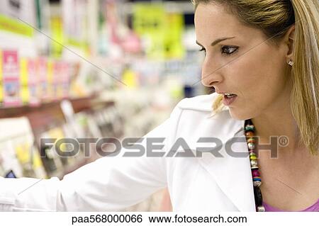 Stock Photograph - Woman shopping, close-up. Fotosearch