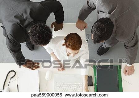 Business associates collaborating on project View Large Photo Image Stock Photograph - Business associates collaborating on project. Fotosearch