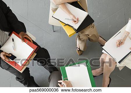 Business people having team-meeting View Large Photo Image Stock Photograph - Business people having team-meeting. Fotosearch
