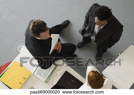 Business people in office having informal meeting View Large Photo Image Stock Image - Business people in office having informal meeting. Fotosearch