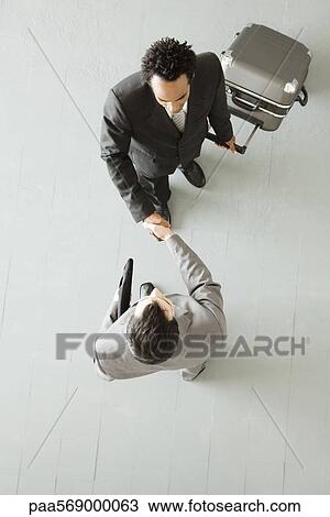 Businessman on business trip meeting contact View Large Photo Image Stock Image - Businessman on business trip meeting contact. Fotosearch