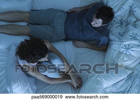 Couple having disagreement in bed View Large Photo Image Stock Photo - Couple having disagreement in bed. Fotosearch