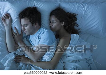 Couple sleeping, woman embracing man View Large Photo Image Stock Image - Couple sleeping, woman embracing man. Fotosearch