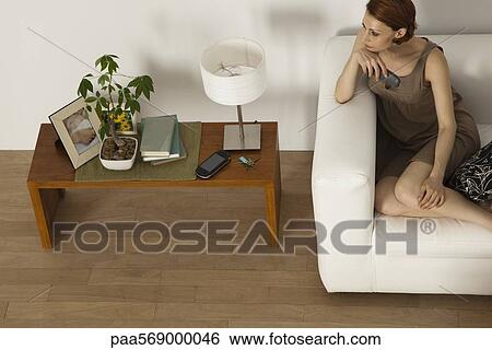 Woman at home watching TV View Large Photo Image Stock Photograph - Woman at home watching TV. Fotosearch