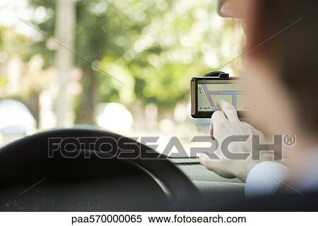 Driver using GPS View Large Photo Image Stock Photography - Driver using GPS. Fotosearch