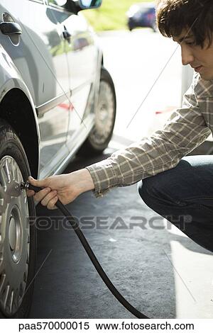 Inflating car tire View Large Photo Image Stock Photography - Inflating car tire. Fotosearch