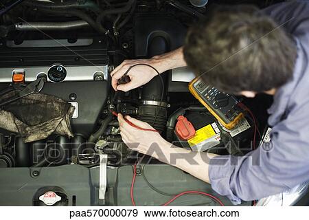 Mechanic diagnosing car engine problem View Large Photo Image Stock Photo - Mechanic diagnosing car engine problem. Fotosearch