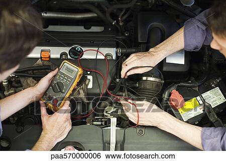 Mechanics tuning car engine View Large Photo Image Stock Photograph - Mechanics tuning car engine. Fotosearch