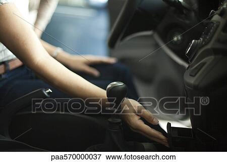 Opening car ashtray, checking out new car interior View Large Photo Image Stock Photo - Opening car ashtray, checking out new car interior. Fotosearch