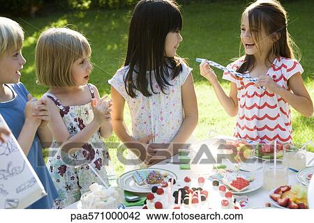 Children at outdoor birthday party View Large Photo Image Stock Image - Children at outdoor birthday party. Fotosearch
