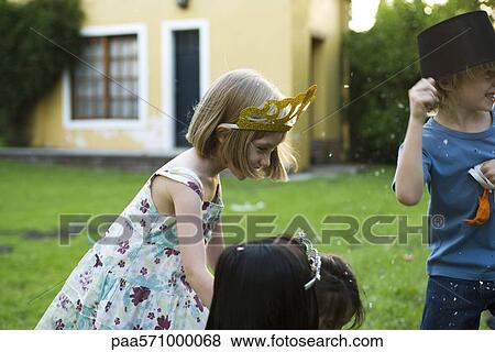 Children having fun at outdoor party View Large Photo Image Stock Photo - Children having fun at outdoor party. Fotosearch