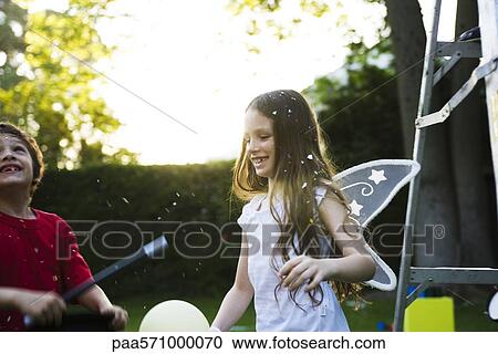 Children having fun under falling confetti View Large Photo Image Stock Image - Children having fun under falling confetti. Fotosearch