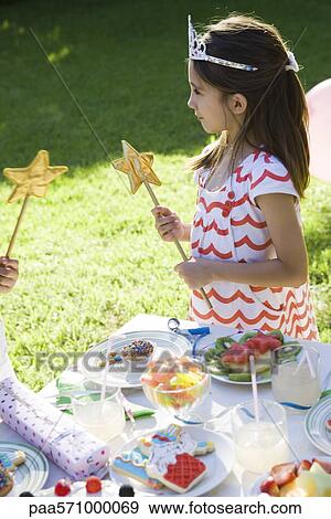 Girl in costume at outdoor birthday party View Large Photo Image Stock Photo - Girl in costume at outdoor birthday party. Fotosearch