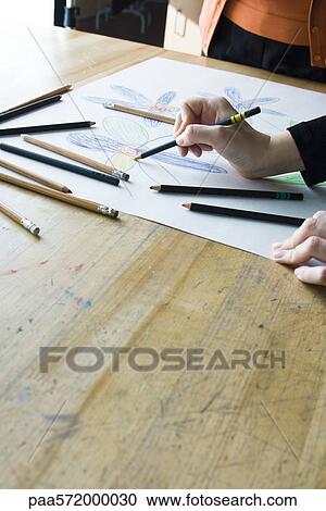 Artist drawing with colored pencils View Large Photo Image Stock Image - Artist drawing with colored pencils. Fotosearch