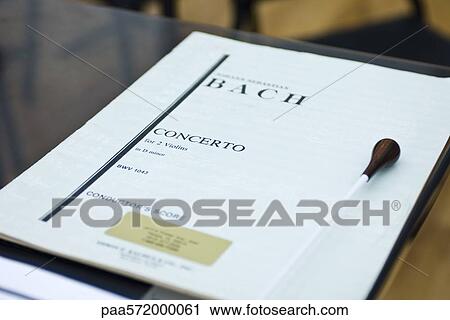 Conductors musical score with baton on stand View Large Photo Image Stock Image - Conductors musical score with baton on stand. Fotosearch
