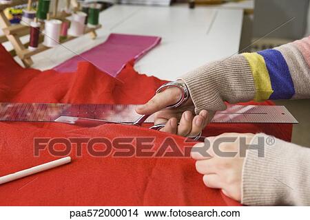 Cutting fabric View Large Photo Image Picture - Cutting fabric. Fotosearch