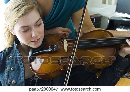 Learning to play the violin View Large Photo Image Stock Photo - Learning to play the violin. Fotosearch