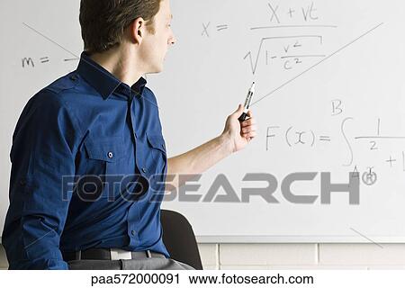 Math teacher explaining equation View Large Photo Image Stock Image - Math teacher explaining equation. Fotosearch