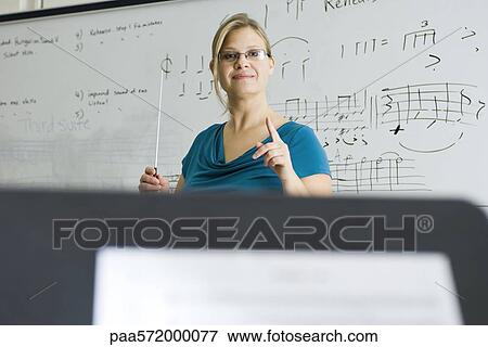Music teacher conducting View Large Photo Image Stock Photo - Music teacher conducting. Fotosearch