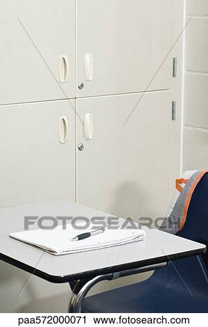 Notebook and pen on school desk View Large Photo Image Stock Image - Notebook and pen on school desk. Fotosearch