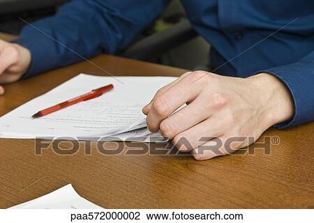 Person reading document View Large Photo Image Stock Image - Person reading document. Fotosearch