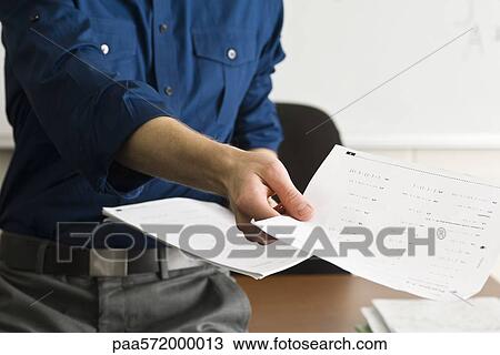 Teacher handing out classwork assignment View Large Photo Image Stock Image - Teacher handing out classwork assignment. Fotosearch