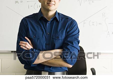 Teacher with arms folded, cropped View Large Photo Image Stock Image - Teacher with arms folded, cropped. Fotosearch