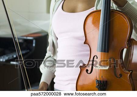Violinist with violin, cropped View Large Photo Image Stock Photo - Violinist with violin, cropped. Fotosearch