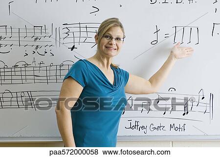 Woman teaching music theory class View Large Photo Image Stock Photo - Woman teaching music theory class. Fotosearch