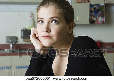 Young woman daydreaming View Large Photo Image Stock Image - Young woman daydreaming. Fotosearch