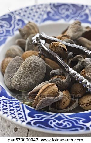 Almonds and nutcracker View Large Photo Image Stock Photo - Almonds and nutcracker. Fotosearch