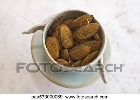 Almonds in bowl View Large Photo Image Stock Photo - Almonds in bowl. Fotosearch