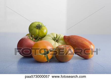 Assorted heirloom tomatoes View Large Photo Image Stock Photo - Assorted heirloom tomatoes. Fotosearch