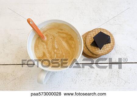 Cappuccino, wafers, and dark chocolate View Large Photo Image Stock Photo - Cappuccino, wafers, and dark chocolate. Fotosearch