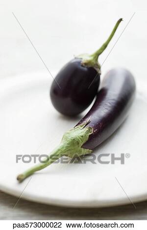 Eggplants on plate View Large Photo Image Stock Image - Eggplants on plate. Fotosearch