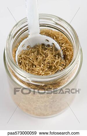 Whole wheat vermicelli in jar with scoop View Large Photo Image Stock Photo - Whole wheat vermicelli in jar with scoop. Fotosearch