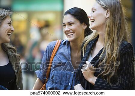 Friends laughing together View Large Photo Image Stock Image - Friends laughing together. Fotosearch