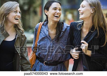 Friends laughing together View Large Photo Image Stock Image - Friends laughing together. Fotosearch