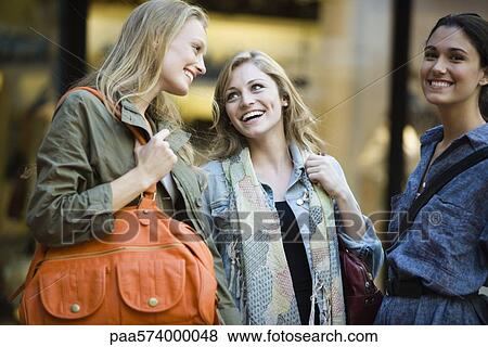 Friends laughing together View Large Photo Image Stock Photo - Friends laughing together. Fotosearch