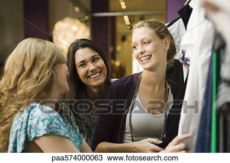 Friends shopping together View Large Photo Image Stock Image - Friends shopping together. Fotosearch