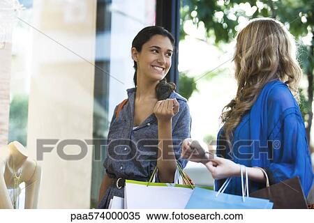 Friends shopping together View Large Photo Image Stock Photography - Friends shopping together. Fotosearch