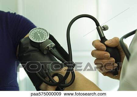 Checking blood pressure View Large Photo Image Stock Photo - Checking blood pressure. Fotosearch