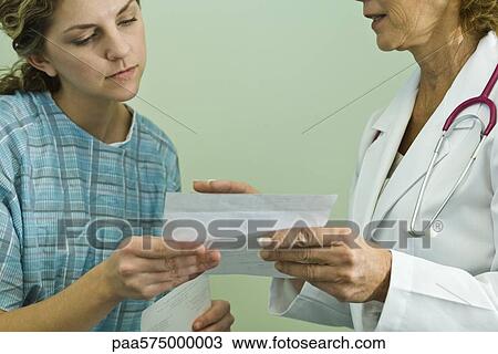 Doctor explaning prescription to patient View Large Photo Image Stock Image - Doctor explaning prescription to patient. Fotosearch